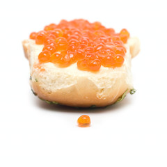Sandwich with red caviar isolated on white