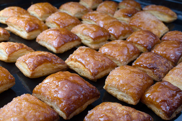 Fresh cookies just from an oven on a black sheet