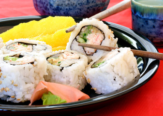 Sushi with fresh mango, ginger, wasabi and saki.