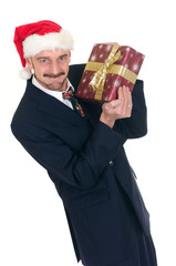 Christmas, middle aged businessman with present, gift.