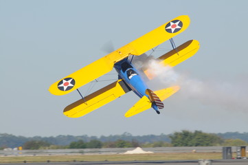 various images from the air show on a beautiful day