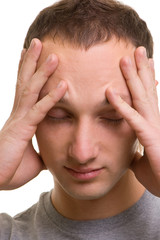 Fototapeta premium young man with headache over white background