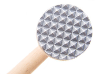 Under the meat mallet. Closeup picture with clipping path