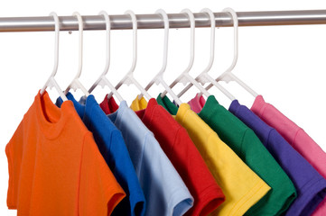 A row of colorful row t-shirts hanging on hangers