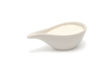 Cream in the ceramic bowl isolated on the white background