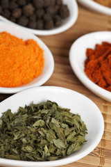 Assortment of spices with shadow in the background. Shallow DOF