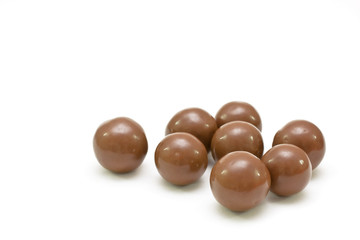Round bonbons isolated on white.