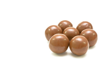 Round bonbons isolated on white.