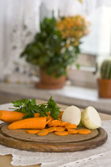Vegetables lying on the tabla on window background