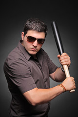 Ready for fight  Young man with a baseball bat