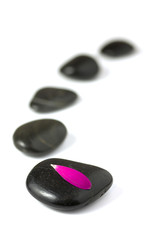 Five black pebbles in a gentle curve