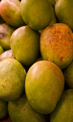 Ripe fresh papayas in a bin at the farmers market