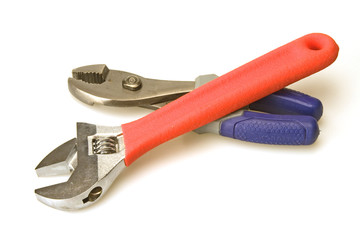 Red handle adjustable wrench and blue handle pliers