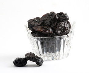 Dried plums isolated on white background