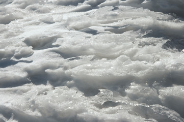 Obraz premium Wind form ice texture on winter mountain snow surface