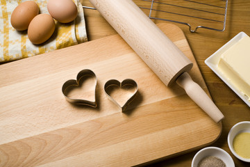 heart shaped cookie cutters, rolling pin, baking ingredients