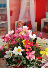 Obraz na płótnie Canvas flowers in red child room