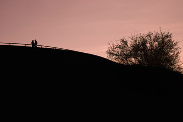 Silhouette of a Couple on a Hill