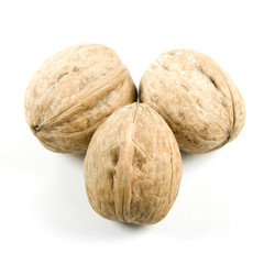 Three walnuts isolated on white.
