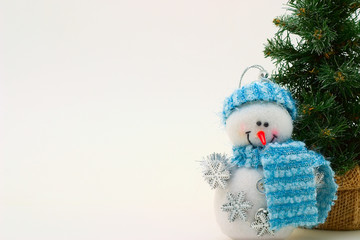 Cristmas card with snowman and cristmas-tree