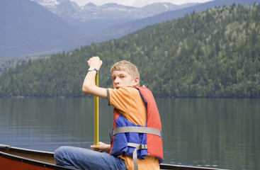 Teenage boy canoeing, Canada