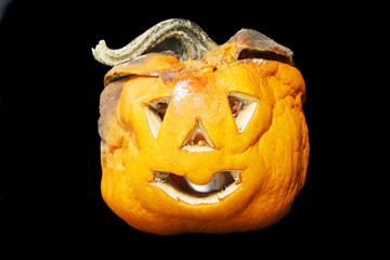 Fototapeta premium Decaying Halloween lantern isolated in black