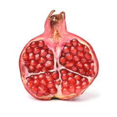 Half of pomegranate. Isolated over white.