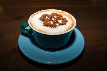 Cup of cappuccino on the cafe table