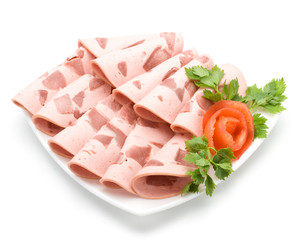 The sausage cut by slices on a dish