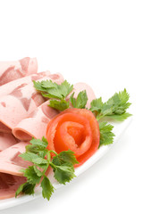 The sausage cut by slices on a dish