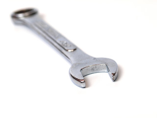 Drop forged steel spanner on white background