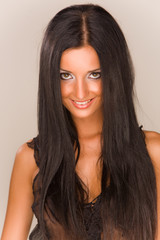 Naklejka premium Beautiful smiling brunet girl, studio isolated