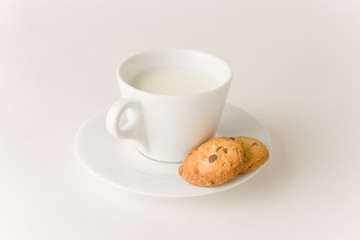 Cup of coffee with milk and cookies, studio isolated