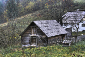 old wooden shack on a mountain meadow