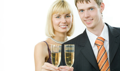 Young couple with tumblers with champagne