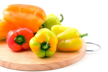 multi-coloured peppers isolated on white