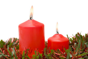 Red candles of Christmas lit on a over white background