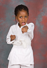 Small karate girl training , on colorful  background © poco_bw