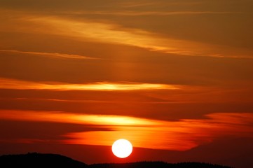 Sunset scene with light cloud layers