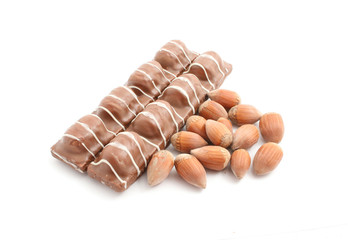 chocolate with hazelnuts isolated on white