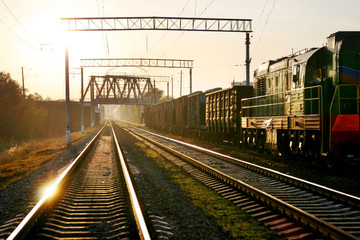 Fototapeta na wymiar train on the railway track on sunset
