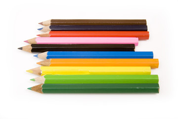 Coloured drawing pencils isolated on a white studio background.