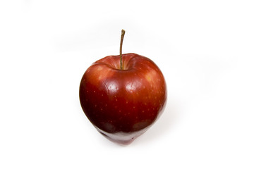 Red apple isolated on a white studio background.