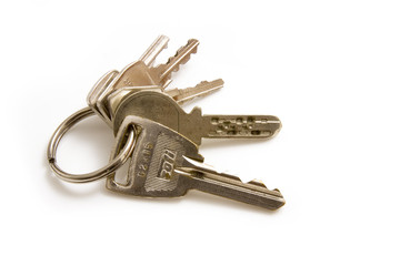 Bunch of house keys isolated on a white studio background.