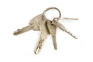 Bunch of house keys isolated on a white studio background.