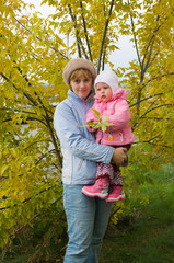 Fototapeta premium the Image of the woman holding on hands of the child