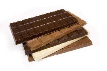 Slabs of chocolate isolated on a white studio background.