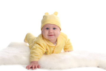 Happy baby on a soft rug