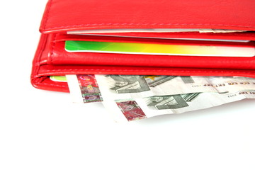 close up od red wallet with money and credit card
