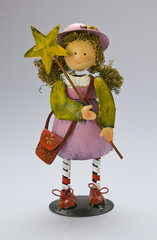 Colorful ironwork doll on the white background in studio